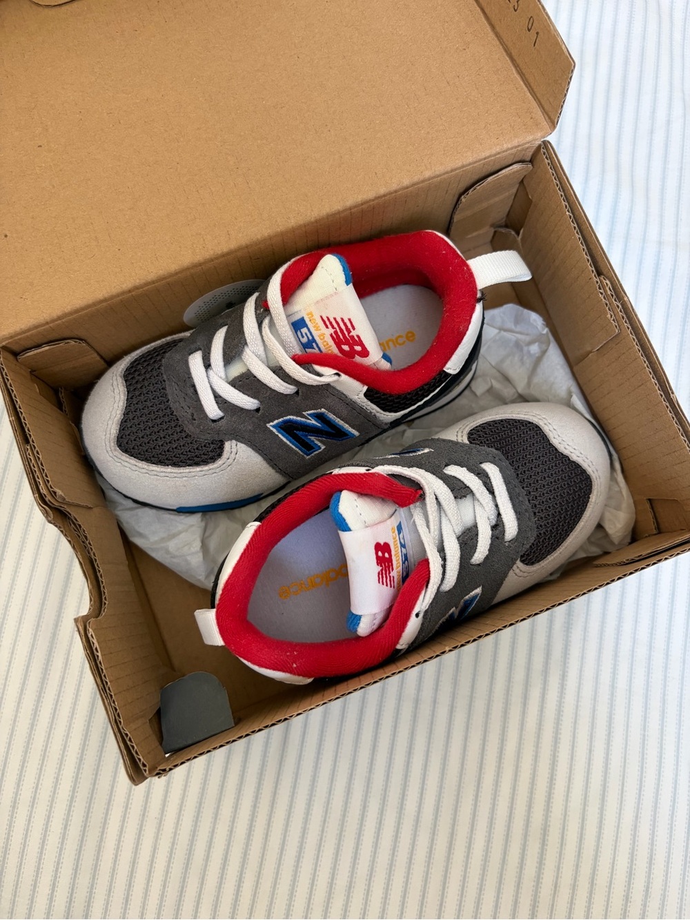 New Balance Kids Gray, White and Red Athletic Sneakers for Baby
